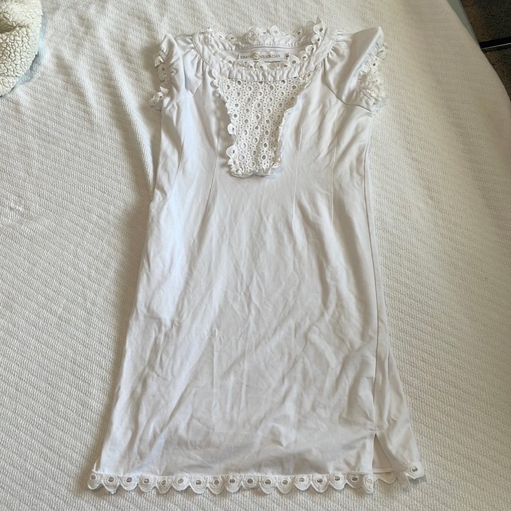 White dress with pattern work.